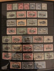 Lot on almost 30 stock pages mixed used and unused incl. Ruanda &amp ...