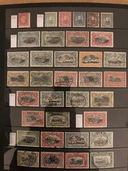 Lot on almost 30 stock pages mixed used and unused incl. Ruanda &amp ...