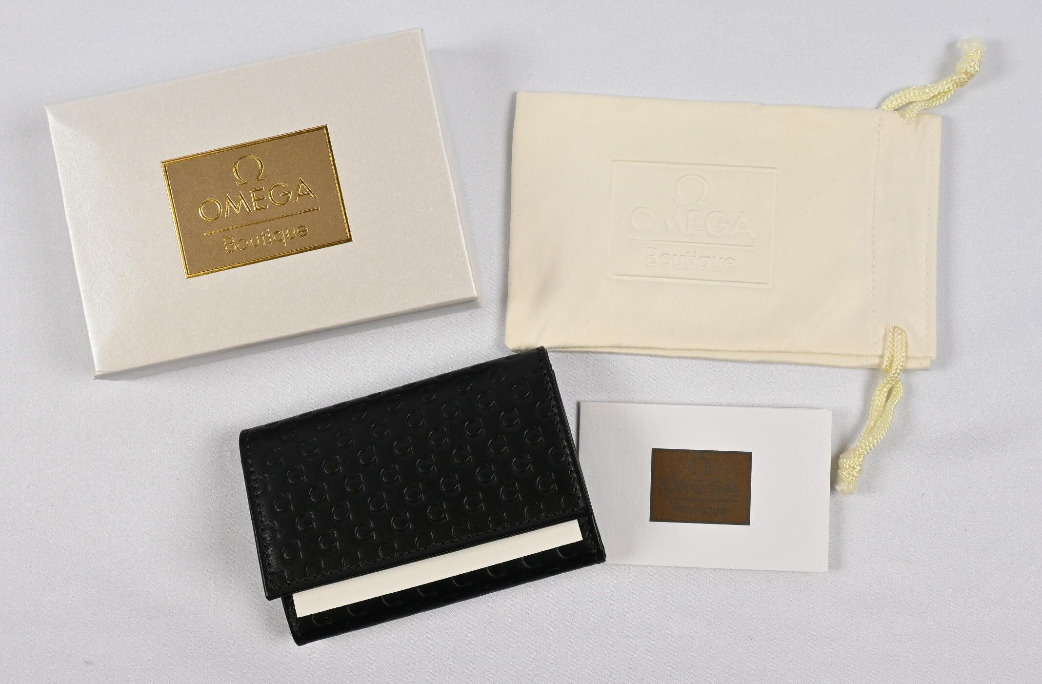 Omega leather case for six keys and credit cards. In unopened ...