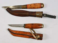 Two old knives, one with a lion transfer image. Normal signs of use