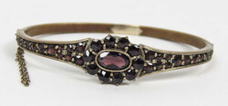 Sehr schöne Granat- Armspange aus Auflösung.Automatically generated ...