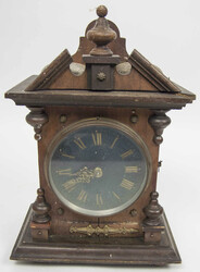 Antique mantel clock with key winding mechanism; key included. ...