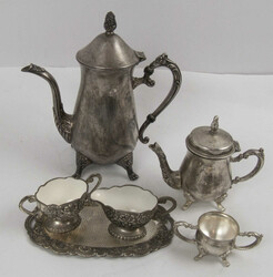Silver-plated coffee and tea service with stylized leaf and flower ...
