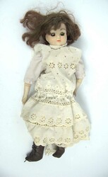 Antique doll, unmarked. Cloth body with porcelain head, feet, and ...