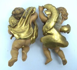 2 Putten aus Holz, farbig bemalt. Mit Wandaufhängung. Länge ca. 20 ...