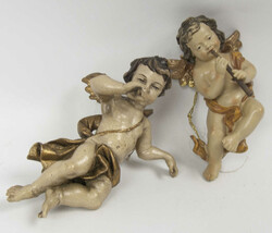 Zwei Putten aus Holz, farbig bemalt, mit Wandaufhängung. Länge ca. ...