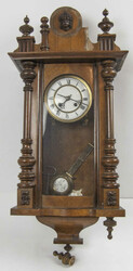 Antique regulator clock. Wooden case with decorative elements, some ...
