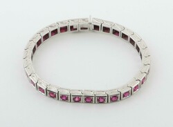 Armband mit Rubinen 20. Jh., Armband in Weißgold 585, bes. mit 30 ...
