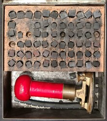 BARROW-IN-FURNESS PARCEL POST HAND STAMPER: A small rusted metal box ...