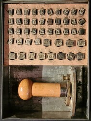 LLANGRANOG PARCEL POST HAND STAMPER: A small rusted metal box with ...