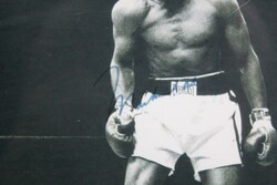 Muhammad Ali signature on photograph of Ali standing over Sonny ...