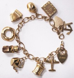 Gold charm bracelet (170mm 9ct 19.78g) with assorted charms attached ...