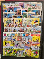 Disney: Two thick stockbooks full with complete sets, souvenir sheets ...